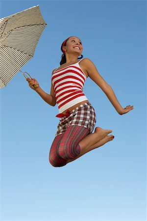 picture of umbrella style - Young woman mid air with umbrella Stock Photo - Premium Royalty-Free, Code: 694-03327333