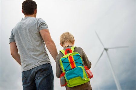 Father and son (7-9) at wind farm Stock Photo - Premium Royalty-Free, Code: 694-03328233