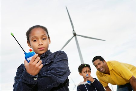 simsearch:694-03328242,k - Father and children (7-9) playing with walky-talkies at wind farm Stock Photo - Premium Royalty-Free, Code: 694-03328245