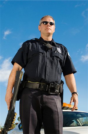 police officer - Police Officer with Shotgun Stock Photo - Premium Royalty-Free, Code: 694-03328453