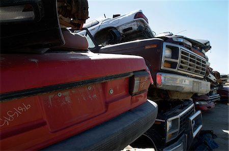 scrap yard pile of cars - Stacked cars in junkyard Stock Photo - Premium Royalty-Free, Code: 694-03328682