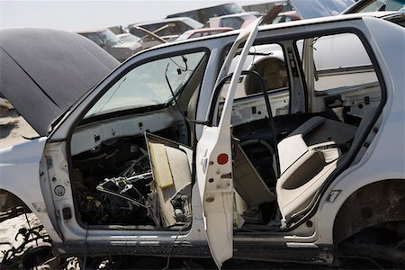 Damaged car in junkyard Stock Photo - Premium Royalty-Free, Code: 694-03328699