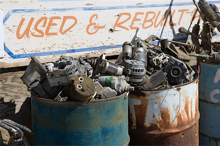 Rusty sign and barrels in junkyard Stock Photo - Premium Royalty-Free, Code: 694-03328708