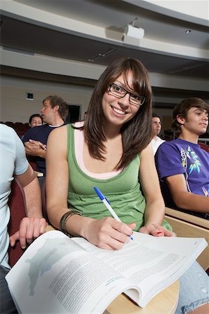 student in lecture hall - Female student working in class, portrait Stock Photo - Premium Royalty-Free, Code: 694-03328909