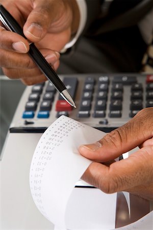 Accountant Reading Adding Machine Tape Foto de stock - Sin royalties Premium, Código: 694-03329167