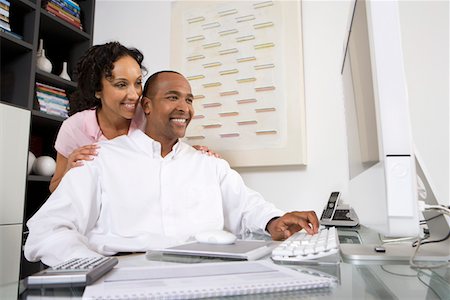 Couple Using a Computer Stock Photo - Premium Royalty-Free, Code: 694-03329301