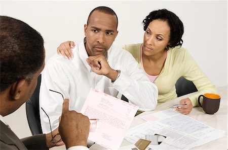 despair african american - Couple Talking with Accountant Stock Photo - Premium Royalty-Free, Code: 694-03329381