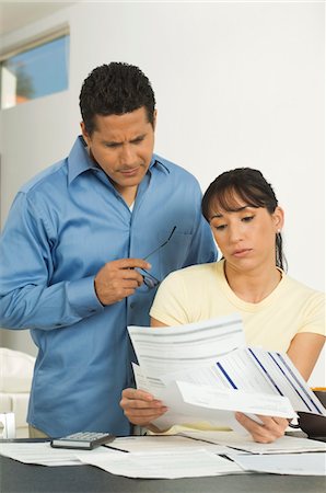 Couple Discussing Bills Stock Photo - Premium Royalty-Free, Code: 694-03329422