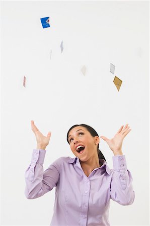 debt - Woman Tossing Credit Cards in the Air Stock Photo - Premium Royalty-Free, Code: 694-03329465