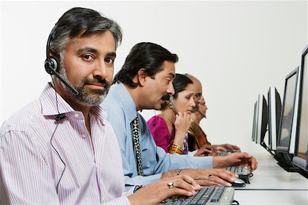 Customer Service Reps in Call Center Stock Photo - Premium Royalty-Free, Code: 694-03329997