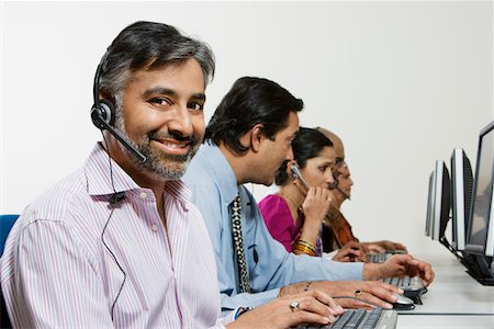 Customer Service Reps in Call Center Stock Photo - Premium Royalty-Free, Code: 694-03329998