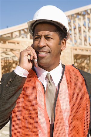 Architect talking on mobile phone Stock Photo - Premium Royalty-Free, Code: 694-03321967