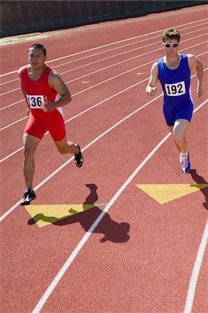 Male sprinters running on track Stock Photo - Premium Royalty-Free, Code: 694-03322945