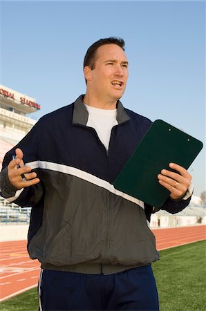 Sports coach giving instructions Stock Photo - Premium Royalty-Free, Code: 694-03323206