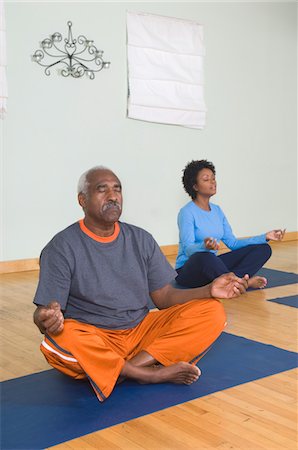 Senior Man Meditating in Yoga Class Stock Photo - Premium Royalty-Free, Code: 694-03323664
