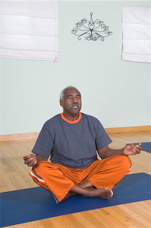 Senior Man Meditating Stock Photo - Premium Royalty-Free, Code: 694-03323662