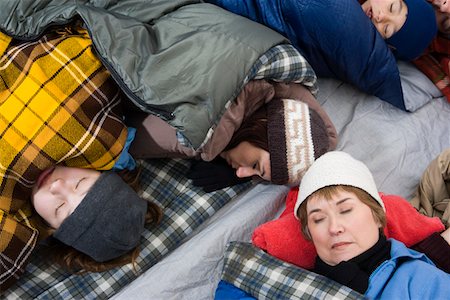 sleeping bag woman - Family sleeping in tent Stock Photo - Premium Royalty-Free, Code: 694-03323799