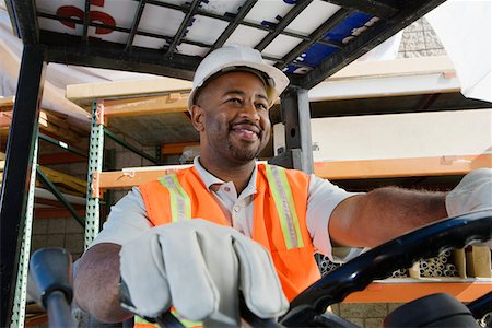 Worker Driving a Forklift Foto de stock - Sin royalties Premium, Código: 694-03330291