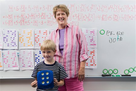 Teacher and Little Boy in Front of Class Stock Photo - Premium Royalty-Free, Code: 694-03330329