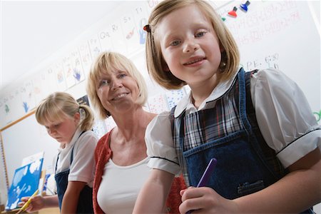 Teacher and Elementary Students Stock Photo - Premium Royalty-Free, Code: 694-03330498