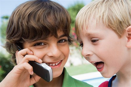 Young Boys Using Cell Phone Stock Photo - Premium Royalty-Free, Code: 694-03330491