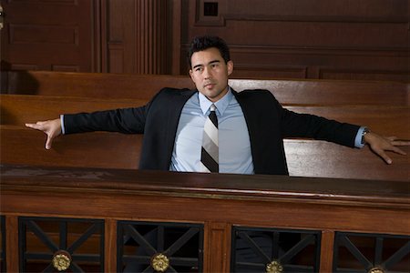 Man sitting in court Stock Photo - Premium Royalty-Free, Code: 694-03330849