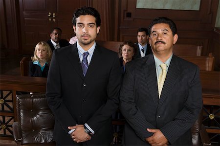 defense lawyer - Two men standing in court, portrait Stock Photo - Premium Royalty-Free, Code: 694-03330840