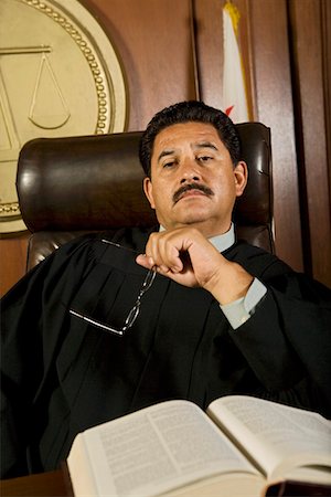 simsearch:694-03330980,k - Pensive judge in court Stock Photo - Premium Royalty-Free, Code: 694-03330885