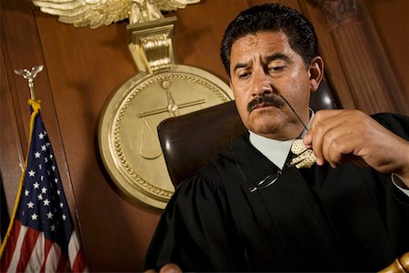 simsearch:694-03330980,k - Pensive judge sitting in court Stock Photo - Premium Royalty-Free, Code: 694-03330898