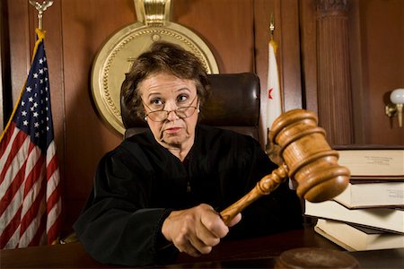 ruling - Judge using gavel in court Stock Photo - Premium Royalty-Free, Code: 694-03330910