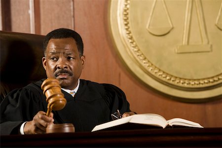 simsearch:693-03312783,k - Middle-aged judge holding gavel Stock Photo - Premium Royalty-Free, Code: 694-03330932