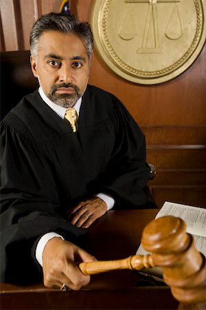 simsearch:693-03312783,k - Middle-aged judge holding gavel Stock Photo - Premium Royalty-Free, Code: 694-03330943