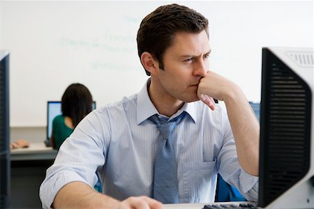 High School Teacher in Computer Lab Stock Photo - Premium Royalty-Free, Code: 694-03331133