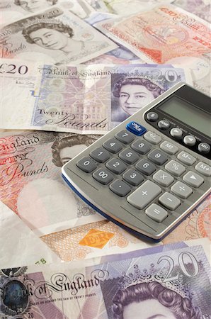 British paper currency and calculator Stock Photo - Premium Royalty-Free, Code: 694-03331414