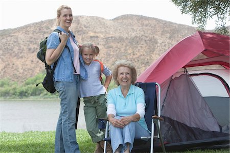 Mother, daughter and grand-daughter outside tent Stock Photo - Premium Royalty-Free, Code: 694-03440965