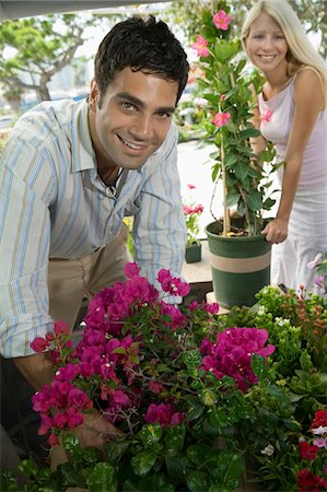 simsearch:694-03692195,k - Couple Selecting flowers at plant nursery, portrait Stock Photo - Premium Royalty-Free, Code: 694-03692198