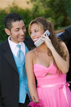 simsearch:694-03318761,k - Well-dressed young couple using cell phone outside Stock Photo - Premium Royalty-Free, Code: 694-03692559