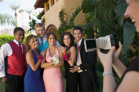 simsearch:694-03318761,k - Well-dressed teenagers posing for video camera outside school dance Stock Photo - Premium Royalty-Free, Code: 694-03692592