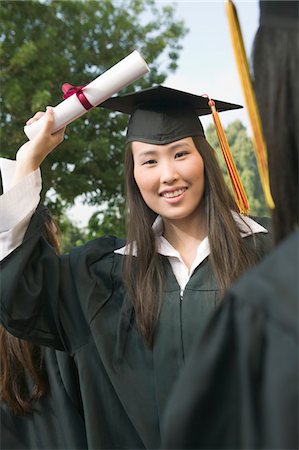 Graduate hoisting Diploma Stock Photo - Premium Royalty-Free, Code: 694-03692600