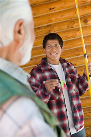 portrait fisherman older - Middle-aged man and son on fishing trip, smiling Stock Photo - Premium Royalty-Free, Code: 694-03692726