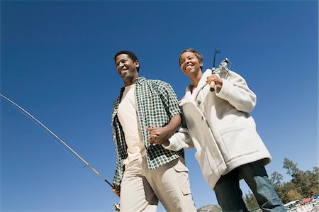 simsearch:694-03783289,k - Couple on fishing trip, holding hand, smiling, (low angle view) Stock Photo - Premium Royalty-Free, Code: 694-03692729
