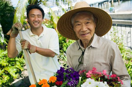 petunia - Senior man and son gardening, (portrait) Stock Photo - Premium Royalty-Free, Code: 694-03692751