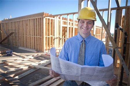 site - Site manager with building plans Stock Photo - Premium Royalty-Free, Code: 694-03783212