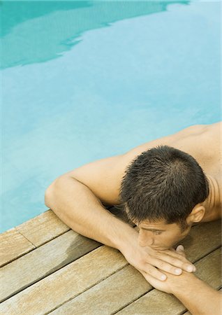 simsearch:632-05845628,k - Homme se trouvant en bord de piscine Photographie de stock - Premium Libres de Droits, Code: 695-05764285