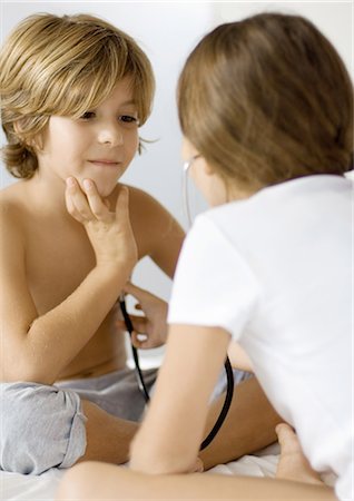 stethoscope girl and boy - Children playing doctor with stethoscope Stock Photo - Premium Royalty-Free, Code: 695-05764390