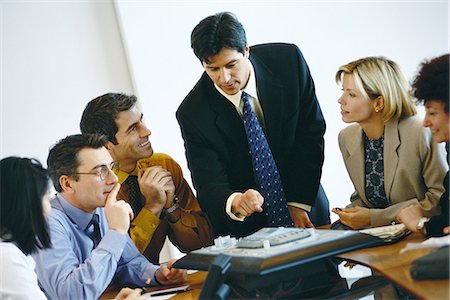 simsearch:6102-08881555,k - Group of business associates having conference call Stock Photo - Premium Royalty-Free, Code: 695-05764500