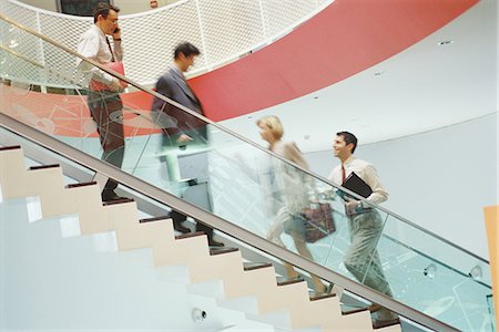 simsearch:695-03381633,k - Business executives going up and down staircase Stock Photo - Premium Royalty-Free, Code: 695-05764520