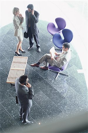 simsearch:632-01148045,k - Business executives in lobby, high angle view Stock Photo - Premium Royalty-Free, Code: 695-05764536