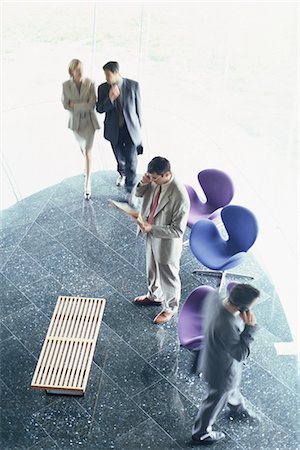 simsearch:695-03381633,k - Business executives in lobby, high angle view Stock Photo - Premium Royalty-Free, Code: 695-05764537