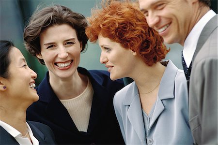 Business team standing together, laughing, portrait Stock Photo - Premium Royalty-Free, Code: 695-05764647